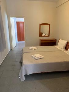Postel nebo postele na pokoji v ubytování GR Apartments Sea View