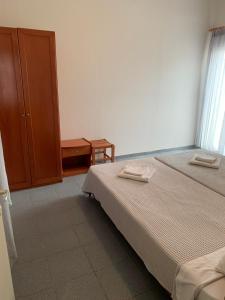 Postel nebo postele na pokoji v ubytování GR Apartments Sea View