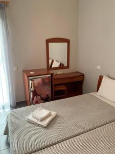 Postel nebo postele na pokoji v ubytování GR Apartments Sea View