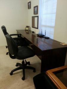 an office with a desk with a chair and a computer at 4 BR / 3 BA Centered in a Fisherman's Paradise in Lillian
