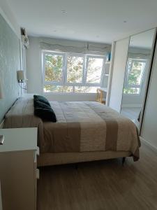 Posteľ alebo postele v izbe v ubytovaní Apartamento Beira Rio Esteiro