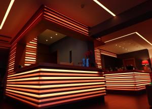 a bar in a restaurant with lights on it at Eco Hotel Cleofe in Caorle