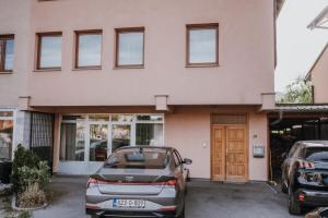 a car parked in front of a building at MASAL Studio Apartman in Bihać