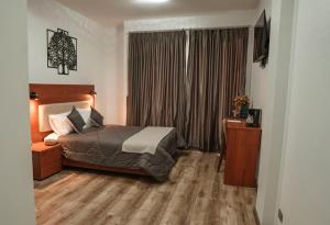 Postel nebo postele na pokoji v ubytování Hotel Sacha Golden