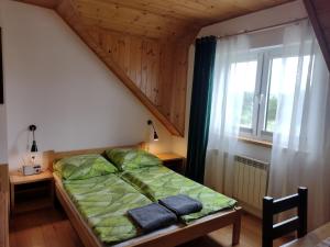 Postel nebo postele na pokoji v ubytování Jurajska Chata