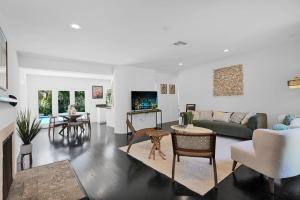 a living room with a couch and a table at Summer Estate - Pool Parking & Prime Location in Miami