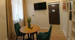 TV a/nebo společenská místnost v ubytování Apartamenty Katarzynki