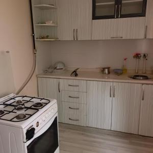 a kitchen with a stove and a counter top at 73 / 3 in Elazığ
