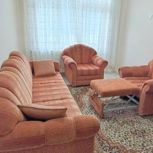 a living room with a couch and two chairs at 73 / 3 in Elazığ