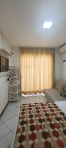 a living room with a checkered rug on the floor at Villa Domenico in Salvador
