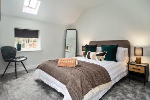 מיטה או מיטות בחדר ב-Coach House by Coppergate Grimsby
