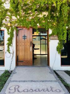 a wooden door with the word recovery written in front of it at Rosarito Hotel in Loreto