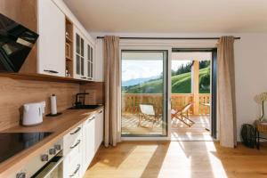 Kuchyň nebo kuchyňský kout v ubytování Seepanorama Apartments am Grundlsee