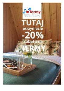 un cartel que lee tiki actualizado detrás de una cama en U Haliny - Blisko Term & Gorącego Potoku en Szaflary