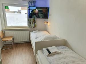 Ένα ή περισσότερα κρεβάτια σε δωμάτιο στο Aparthotel Sanni