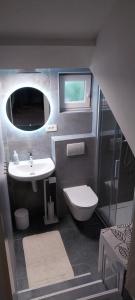 a small bathroom with a sink and a toilet at Holiday house Belavista in Novi Vinodolski +54 photos