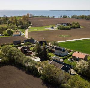 an aerial view of a farm with a field at Large Architect designer home 800m from beach in Glumslöv