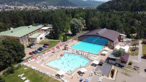 an overhead view of a large swimming pool in a resort at Luxury Bucovina in Gura Humorului