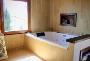 a bathroom with a large tub in a room at Agriturismo Suite del Conte in San Vincenzo