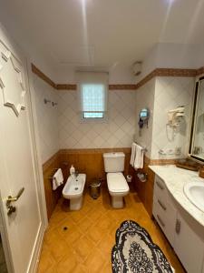 a bathroom with a toilet and a sink at sharm prestige room 52 - luxury sea view at coral bay in Sharm El Sheikh