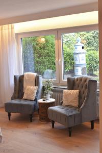 Posezení v ubytování Ferienwohnung Waldborn-Suite an der Mosel