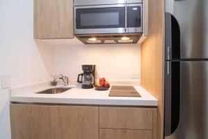 Kuchyň nebo kuchyňský kout v ubytování A Perfect Place + 24 fotografií