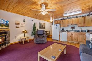a living room with a couch and a table at Bugle Pointe B10 by Estes Park Condos in Estes Park