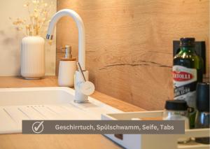 a kitchen sink with a toothbrush and a faucet at Relax Apartment - für Familien, stadtnah, mit Parkplatz in Koblenz +35 photos