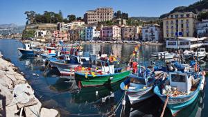 a group of boats are docked in a harbor at Mary's Dream - Villa overlooking Capri and Ischia in Sorrento Peninsula in Massa Lubrense