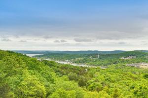 a view of a river from a hill with trees at Secluded Branson Escape with Pool and Game Room! in Branson