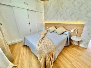 Postel nebo postele na pokoji v ubytování Lunamar Luxury Place