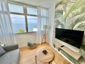 TV a/nebo společenská místnost v ubytování Lunamar Luxury Place