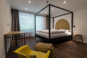 En eller flere senge i et værelse på schlossmühle - lean luxury boutique hotel