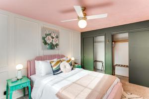 a bedroom with a bed and a ceiling fan at Vibrant Tacoma Retreat, Near Point Defiance Park! in Tacoma