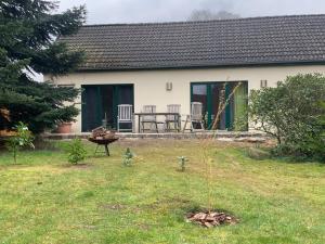 a small tree in the yard of a house at mf Guesthouse in Sukow
