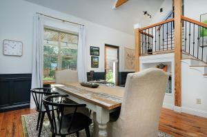 a dining room with a table and chairs at 1920's Farmhouse In Town With Hot Tub &mntn Views in Buena Vista