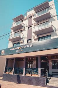 a hotel with a sign that reads meridian center hotel at Avenida Center Hotel in Uruguaiana