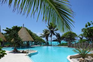a swimming pool with a view of the ocean at InterContinental Lifou Wadra Bay Resort in Akaouane