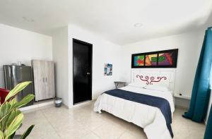 Voodi või voodid majutusasutuse Caribbean Island Hotel toas