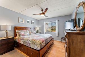 a bedroom with a bed with a dresser and a mirror at Beachside Retreat-Courtyard Villa-Beachside condo in Saint Augustine Beach