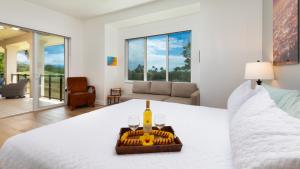 Katil atau katil-katil dalam bilik di ❤PiH❤ Sun Ray RetreatOcean Sunsets ViewsOptional Mauna Kea Hotel Privileges