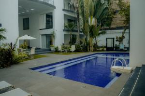 a swimming pool in the middle of a building at Almarea Vacation Condo in Playa del Carmen