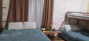 a bedroom with two bunk beds and a table at CASA TUCAN in San Miguel