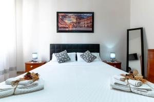 A bed or beds in a room at Appartamento Al Posto Giusto