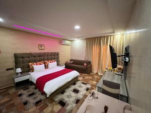 a bedroom with a large bed and a couch at Superbe villa marrakech in Marrakech +29 photos