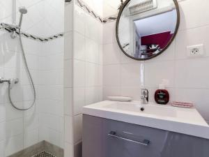 a white bathroom with a sink and a mirror at Le Cezanne in Aix-en-Provence +10 photos