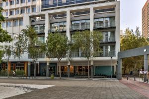 an office building with a courtyard in front of it at WINK Aparthotel Foreshore in Cape Town
