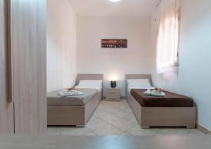 A bed or beds in a room at Appartamento Al Posto Giusto