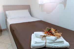 A bed or beds in a room at Appartamento Al Posto Giusto