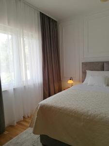Postel nebo postele na pokoji v ubytování Green Park Apartments